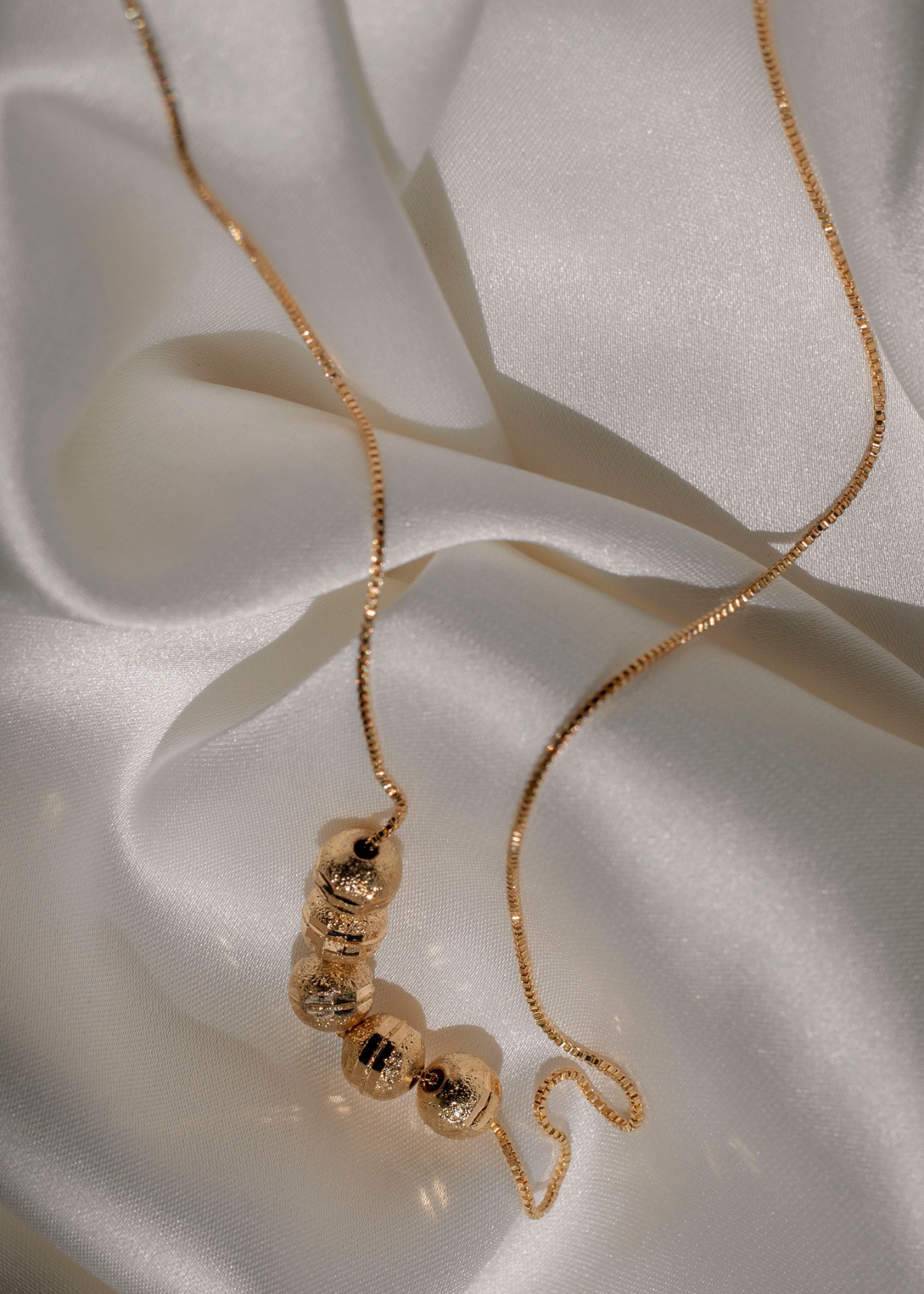Gold bead layered necklace